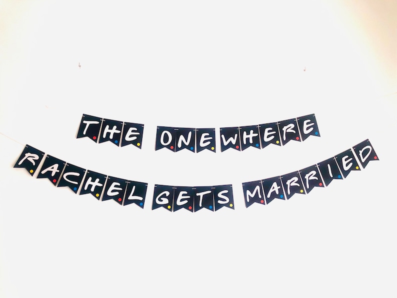 May include: Black and white banner with the text "The One Where Rachel Gets Married" in a white font. The banner is decorated with colorful dots.