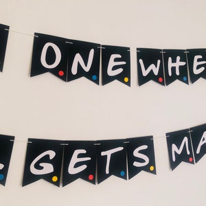 May include: Black and white banner with the text "The One Where... Gets Married" in a white, handwritten font. The banner is decorated with colorful dots.