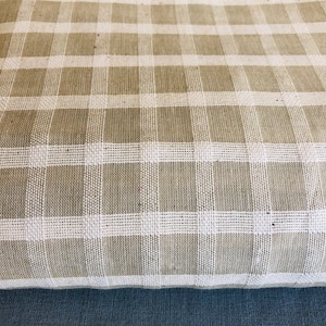 Organic handwoven cotton fabric .