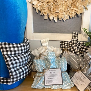 May include: Four microwavable rice bags in different patterns. The bags are made of fabric and have a label that says "Microwavable Rice Bag".