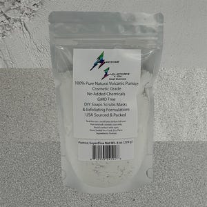 May include: A clear, sealed bag containing white pumice powder. The label reads "100% Pure Natural Volcanic Pumice" and "Cosmetic Grade." The bag also states the product is GMO-free and suitable for DIY soaps, scrubs, and masks. Net weight is 8 oz.