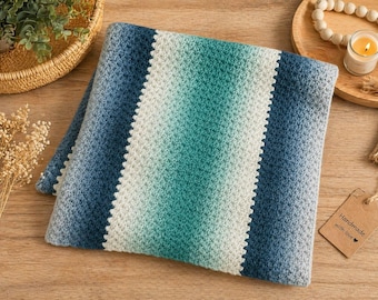 Manta gruesa azul, verde y blanca