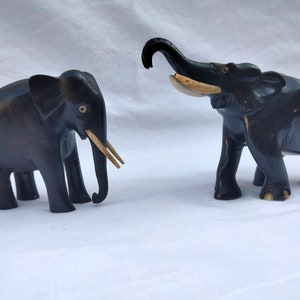 Elephants (2) - Ivory, Ebonized wood, India, 20th century