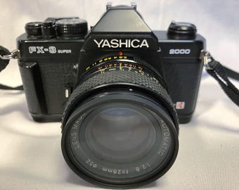 Film Tested 1986 Yashica FX-3 Super 2000 35mm SLR Camera W/ Yus 28mm 1:2.8 Lens, a Tokina 70-210mm Zoom, and Instructions. Working! #3413