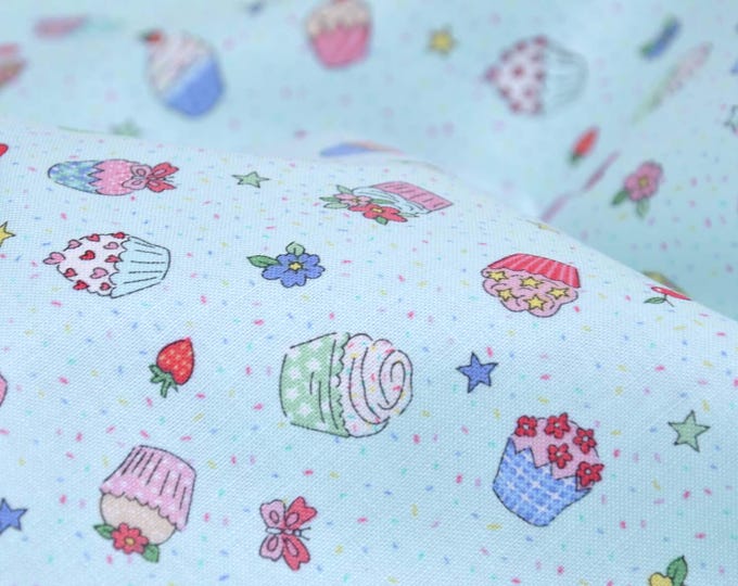 Cotton fabric printed with cupcakes, cherries, and flowers by Makower - 110 cm wide - smooth, patterned fabric