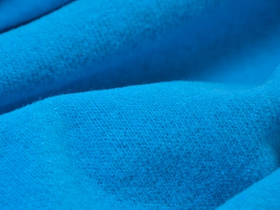 Strickstoff Gillo aus Baumwolle in blau, türkis von Hilco - 175cm breit - Stoff matt, melange