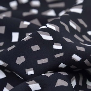 Blouse fabric in black with rectangles in beige, white - 145 cm wide - smooth fabric, geometric pattern