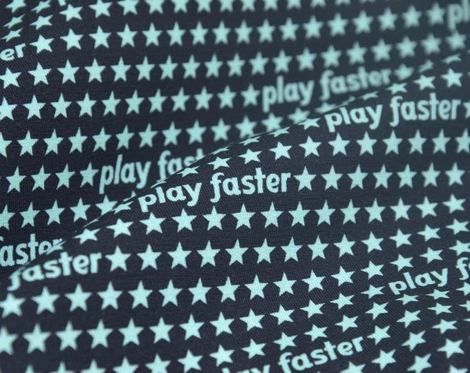 Children's jersey in black with turquoise stars, made of cotton - 150 cm wide - two-tone patterned fabric