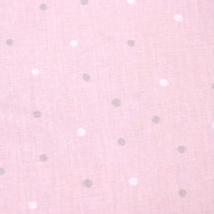 Pode incluir: Um tecido rosa com um padrão de bolinhas brancas e cinzas.