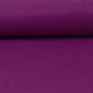 May include: Close-up of a deep purple fabric with a smooth, slightly textured surface.