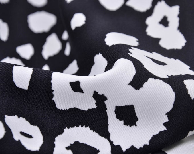 Jersey bi elastisch schwarz, weiß Leo-Print - 140cm breit - Stoff leicht glänzend Leo