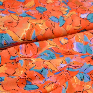 Viscose jersey, flowers, orange, Editex, sold by the meter