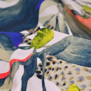 Viscose jersey with leaves, green, beige, purple, yellow by Hilco Florare - 145 cm wide - smooth, patterned fabric