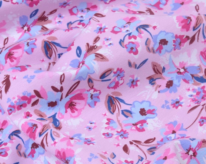 Children's cotton jersey with flowers in purple, pink, and blue - 140 cm wide - matte, patterned fabric
