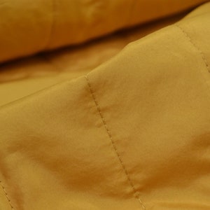 Water-repellent quilted fabric by Mind the Maker in mustard - 140 cm wide - smooth fabric UNI