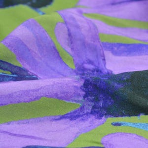 Viscose blouse fabric with large purple flowers, green by Hilco Sonnenhut - 140 cm wide - smooth, patterned fabric