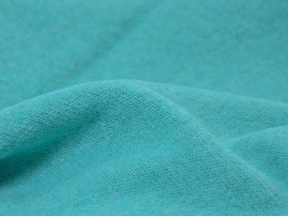 Strickstoff Gillo aus Baumwolle in türkis, grün von Hilco - 175cm breit - Stoff matt, melange