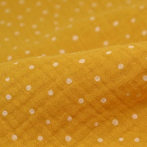 The muslin fabric is made of 100% cotton, yellow with white polka dots - 135 cm wide - two-tone fabric, polka dots