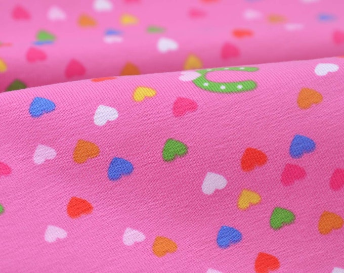 Children's cotton jersey with hearts, horseshoes in pink, green - 145 cm wide - matt, patterned fabric