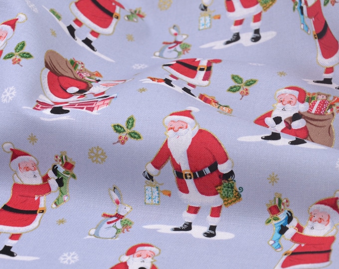 Baumwollstoff hellgrau mit Weihnachtsmännern, Geschenken, Gold - 110cm breit - Stoff glatt, Weihnachten