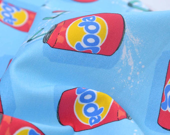 Sweatstoff in hellblau mit Softdrink Dosen, rot, gelb, grün, aus Baumwolle - 160cm breit - Stoff glatt, gemustert