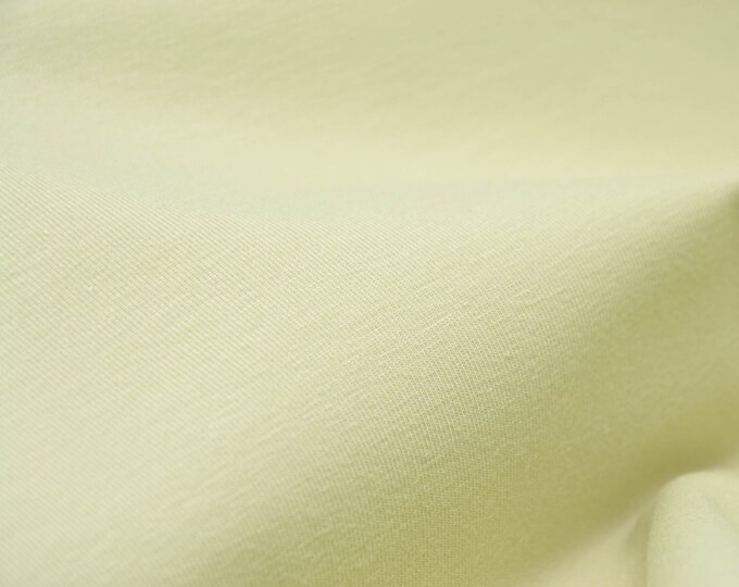 Jersey in uni hellgrün aus Baumwolle, glatt und dünn - 145cm breit - Stoff matt, UNI