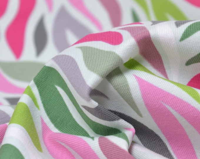 Kinderjersey aus Baumwolle mit Blättern in grün, pink, rosa - 145cm breit - Stoff matt, gemustert