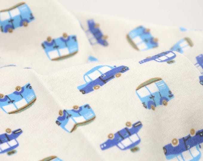 Children's jersey in cream-white with blue cars made of cotton - 90 cm wide - matt fabric, patterned