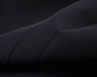 Stretch denim in dark blue cotton - 125 cm wide - fabric with a slight sheen, solid color