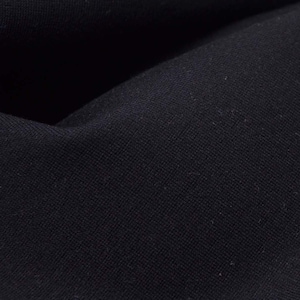May include: Close-up of a dark blue fabric with a textured weave.