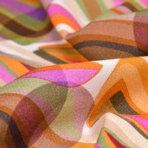 Viscose jersey with circles, green, orange by Hilco Pretty Kitti - 145 cm wide - smooth fabric, geometric pattern