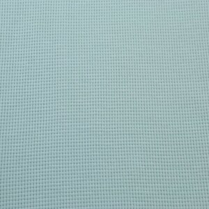 May include: A light blue textured fabric with a subtle grid pattern.