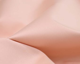 Dress fabric made of cotton satin with stretch in solid salmon, pink, glossy - cm wide - fabric slightly shiny, solid color