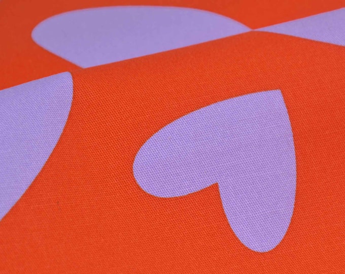 Hosenstoff mit Herzen in orange-lila, gemustert aus Baumwolle mit Stretch - 145cm breit - Stoff zweifarbig, gemustert