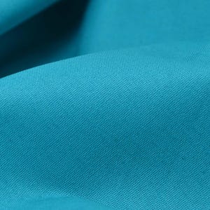 以下が含まれることがあります： テクスチャのある織り地のターコイズブルーの生地のクローズアップ。生地は滑らかで、わずかに光沢があります。
