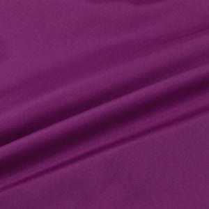 May include: A close-up of a smooth, deep purple fabric with a soft, flowing drape.
