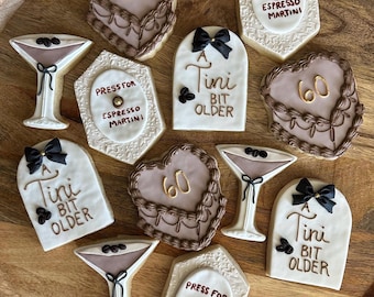 A tini bit older, decorated sugar cookies! Espresso Martini themed sugar cookies, by the dozen, made to order, individually wrapped!