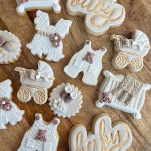 baby shower sugar cookies, neutral and gold color themed, sold per dozen, customizable. Baby onesie cookies