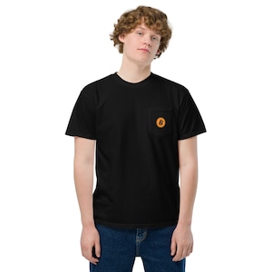 May include: A black t-shirt with a pocket on the left side. The pocket has a small orange and brown Bitcoin logo.