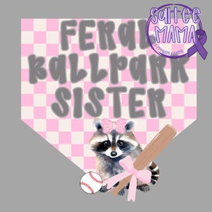May include: A graphic design featuring a raccoon with a pink bow, holding a baseball bat and a baseball. The text reads "FERAL BALLPARK SISTER" in gray letters on a pink and white checkered background. The design includes the text "Saltee Mama".