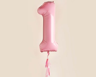May include: A pink number one balloon with a pink tassel hanging from the bottom.