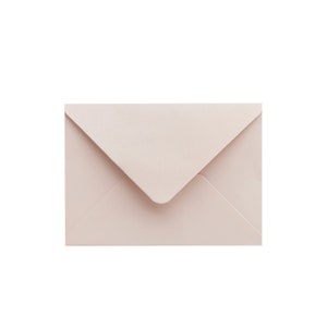 May include: A light pink envelope with a standard size and shape.