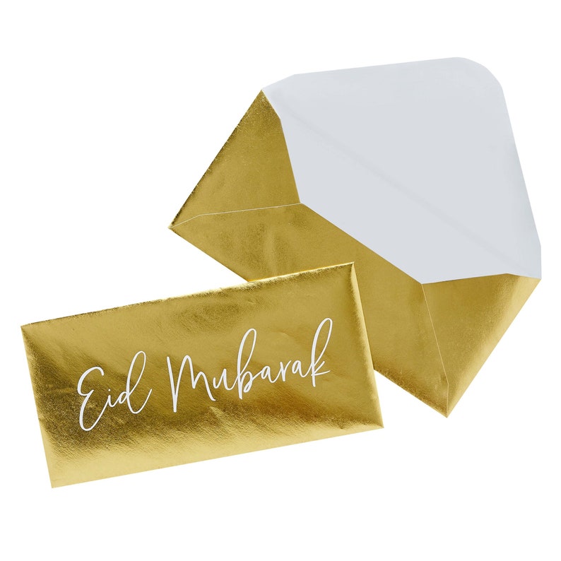 May include: Gold envelope with a white inscription that reads "Eid Mubarak".