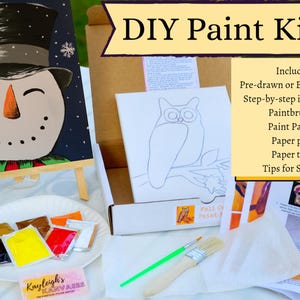 May include: DIY paint kit with a pre-drawn canvas featuring a snowman with a black top hat and a green and red scarf. The kit includes paint packets, paintbrushes, a paper plate, a paper towel, and step-by-step instructions.  Included: Pre-drawn or Blank Canvas Step-by-step instructions Paintbrushes Paint Packets Paper plate Paper towel Tips for Success