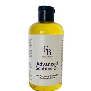 May include: A clear glass bottle containing a yellow liquid. The bottle has a black cap and a white label that reads "Advanced Scabies Oil" and "100% Pure Natural Essential Oils Handmade in the UK".