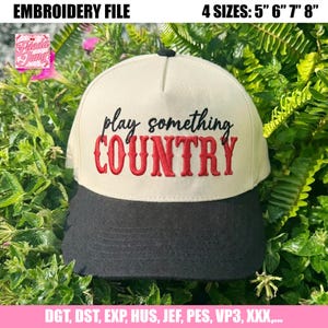 May include: A beige and black baseball cap with the text "play something COUNTRY" embroidered in red and black. The cap has a curved brim and a black button on top. The image also includes text that says "EMBROIDERY FILE" and "4 SIZES: 5" 6" 7" 8""