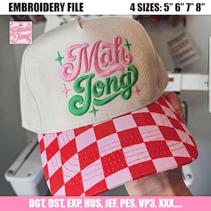 May include: A beige baseball cap with a red and pink checkered brim. The cap features the embroidered text "Mah Jong" in pink and green, with star accents. The image also includes the text "EMBROIDERY FILE" and "4 SIZES: 5" 6" 7" 8"".