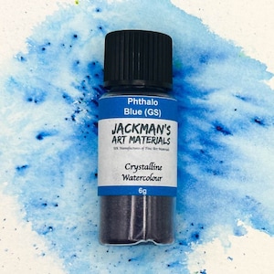 May include: A small bottle of Phthalo Blue (GS) crystalline watercolour paint by Jackman's Art Materials. The bottle is 6 grams and has a black lid.