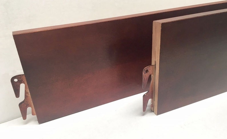 May include: Two wooden headboard panels with metal brackets. The panels are a dark reddish-brown color.