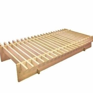 May include: A wooden slat bed frame with a slatted base. The frame is made of natural wood and has a simple, modern design.